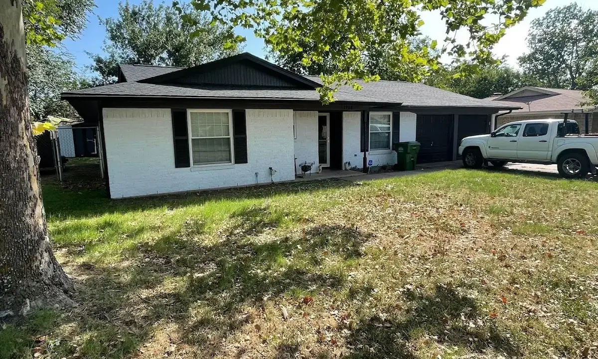 Professional roofing crew working on a residential roof in New Bedford